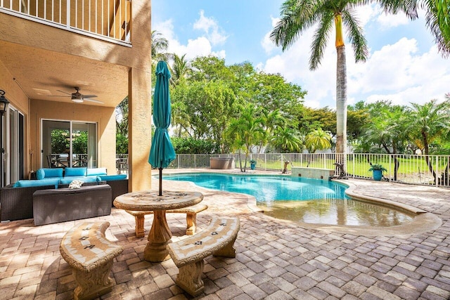 view of pool featuring a fenced backyard, a ceiling fan, an outdoor hangout area, and a patio