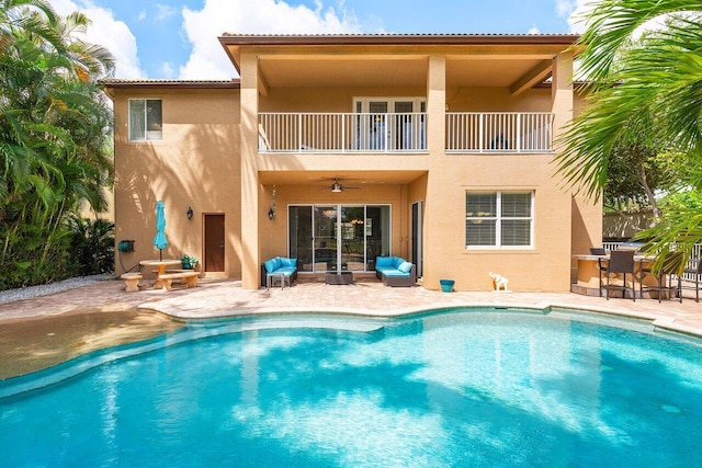 exterior space with a ceiling fan and a patio