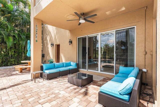view of patio featuring outdoor lounge area and a ceiling fan
