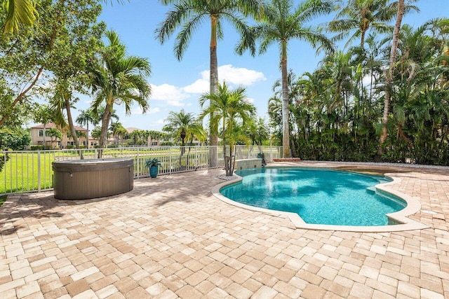 view of swimming pool with a fenced in pool, a patio, and fence