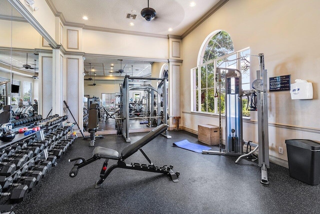 gym with baseboards, visible vents, recessed lighting, a ceiling fan, and ornamental molding