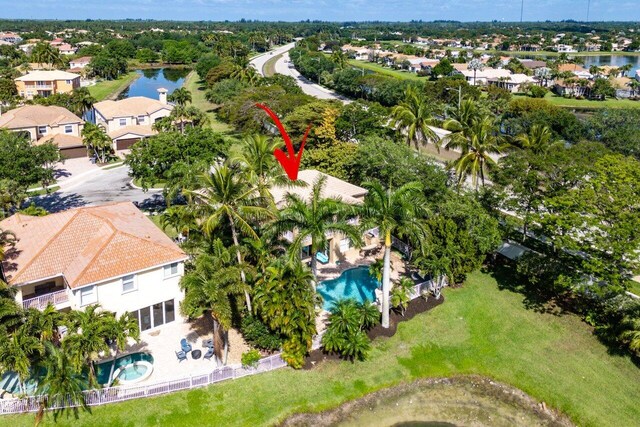 drone / aerial view with a water view and a residential view
