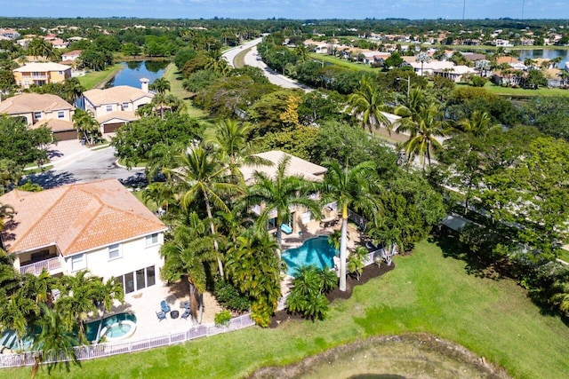 drone / aerial view featuring a residential view and a water view