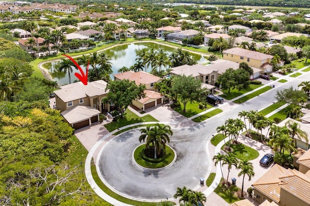 birds eye view of property featuring a residential view and a water view
