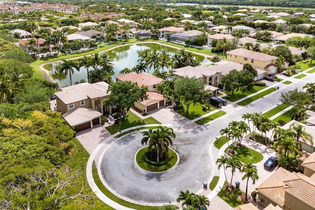 birds eye view of property with a water view and a residential view