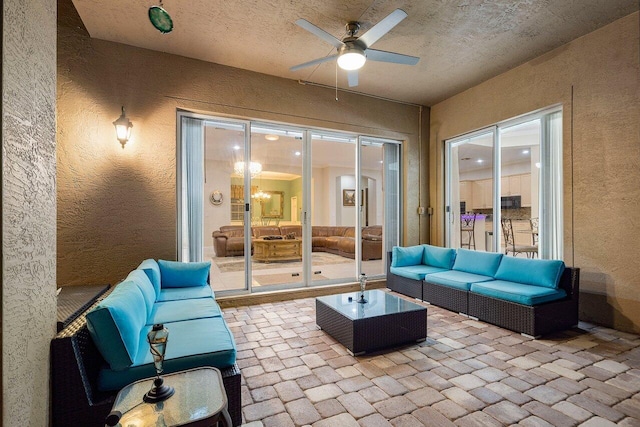 view of patio / terrace featuring an outdoor living space and ceiling fan