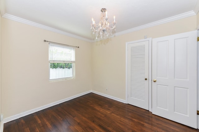 340 Russlyn Dr, West Palm Beach, FL 33405 - unfurnished bedroom featuring dark wood-style flooring, a chandelier, baseboards, crown molding, and a closet