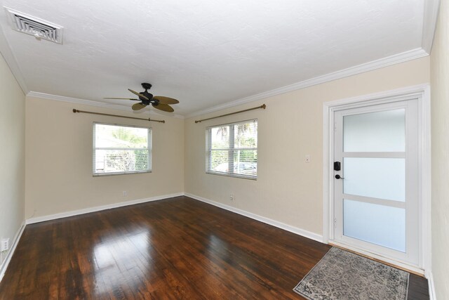 340 Russlyn Dr, West Palm Beach, FL 33405 - unfurnished room with dark wood-style flooring, baseboards, crown molding, and ceiling fan