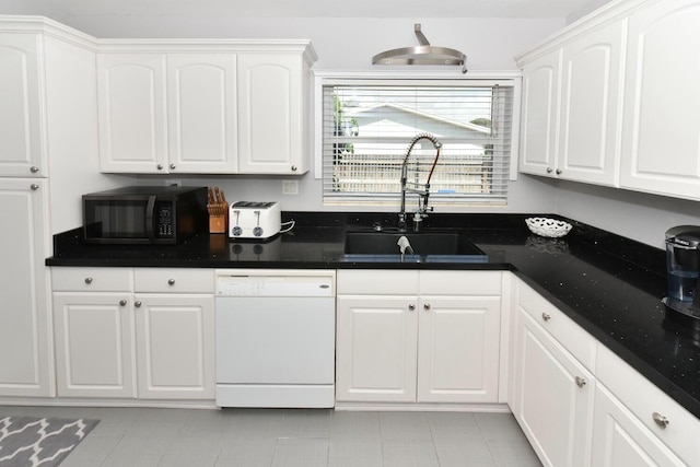 340 Russlyn Dr, West Palm Beach, FL 33405 - kitchen featuring white dishwasher, black microwave, a sink, and white cabinetry