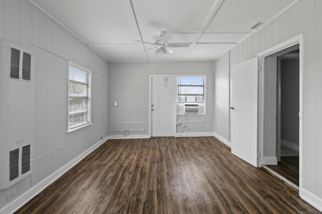 652 Bayberry Dr, Lake Park, FL 33403 - unfurnished room with dark wood-type flooring, a ceiling fan, visible vents, and a heating unit