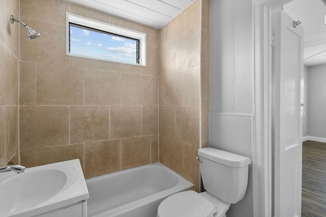 652 Bayberry Dr, Lake Park, FL 33403 - full bath featuring washtub / shower combination, wood finished floors, toilet, and a sink
