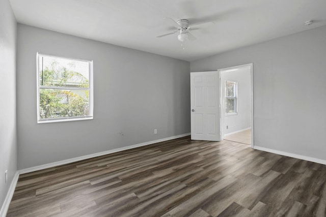 652 Bayberry Dr, Lake Park, FL 33403 - spare room with dark wood-type flooring, baseboards, and ceiling fan