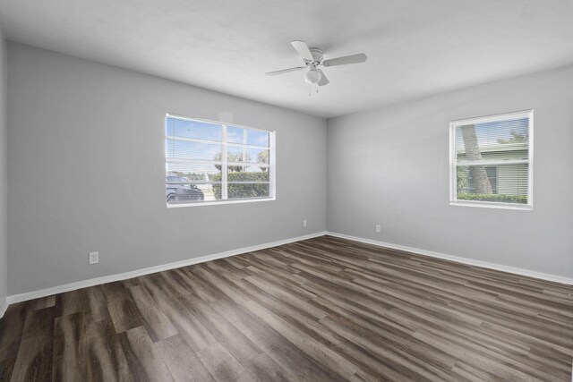 652 Bayberry Dr, Lake Park, FL 33403 - empty room featuring baseboards, wood finished floors, a ceiling fan, and plenty of natural light
