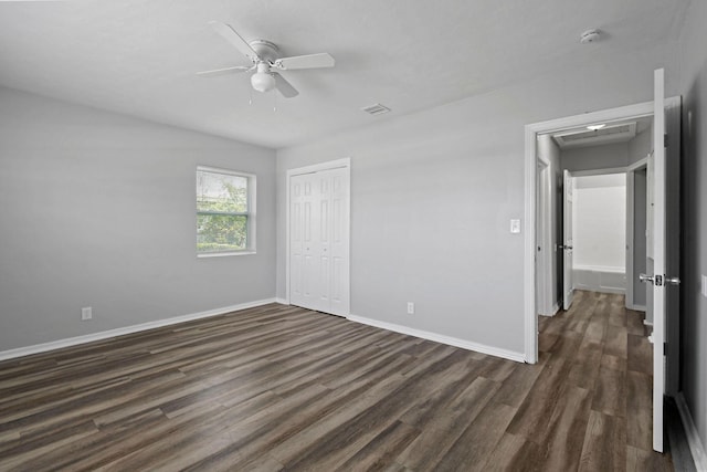 652 Bayberry Dr, Lake Park, FL 33403 - unfurnished bedroom with baseboards, dark wood-type flooring, a closet, and visible vents
