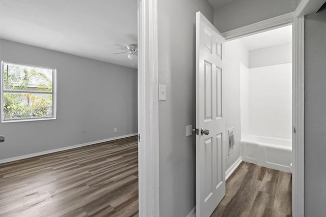 652 Bayberry Dr, Lake Park, FL 33403 - corridor featuring baseboards and wood finished floors