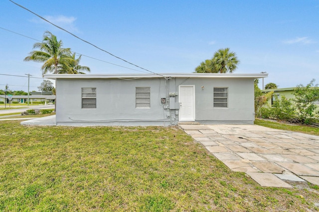 652 Bayberry Dr, Lake Park, FL 33403 - ranch-style house featuring stucco siding and a front yard