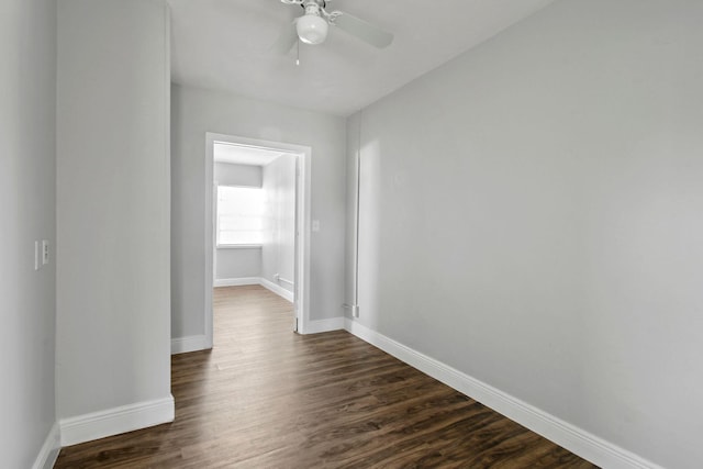 652 Bayberry Dr, Lake Park, FL 33403 - hallway featuring baseboards and dark wood-style floors