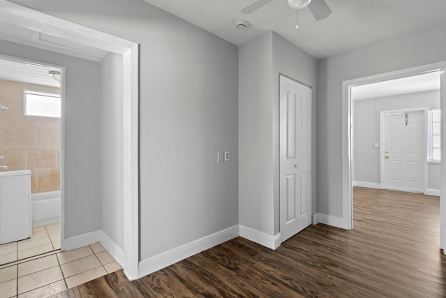 652 Bayberry Dr, Lake Park, FL 33403 - interior space with connected bathroom, baseboards, a closet, and wood finished floors