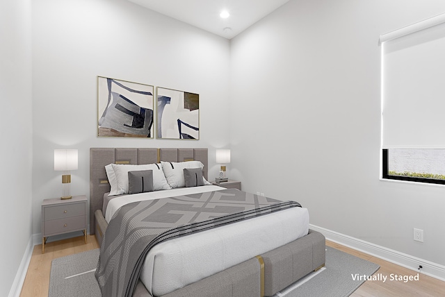 13471 Artisan Cir, Palm Beach Gardens, FL 33418 - bedroom with wood finished floors and baseboards