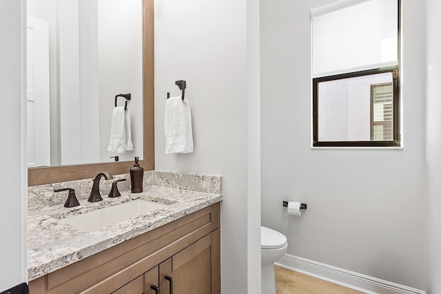 13471 Artisan Cir, Palm Beach Gardens, FL 33418 - bathroom with vanity and wood finished floors