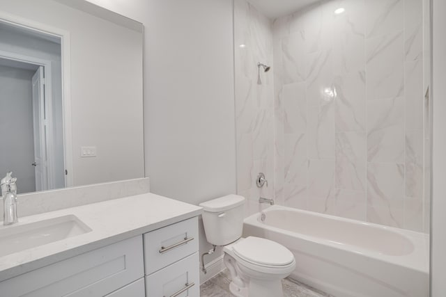 bathroom with tub / shower combination, toilet, baseboards, and vanity