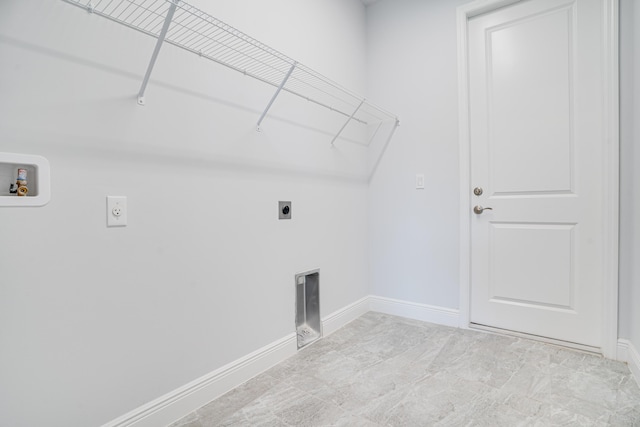 laundry area featuring electric dryer hookup, hookup for a washing machine, baseboards, and laundry area