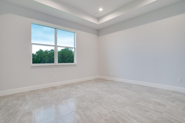 unfurnished room featuring baseboards and recessed lighting