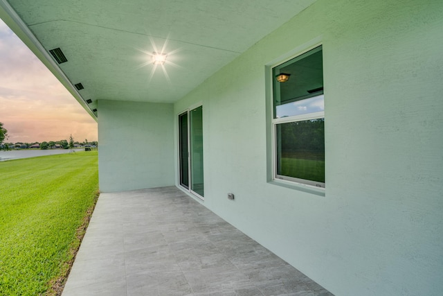 view of patio featuring a water view