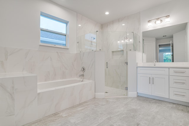 bathroom featuring visible vents, a garden tub, vanity, and a marble finish shower