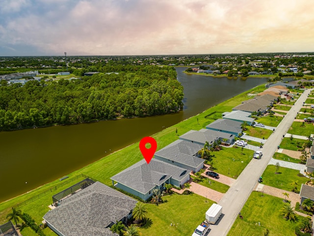 drone / aerial view featuring a residential view and a water view
