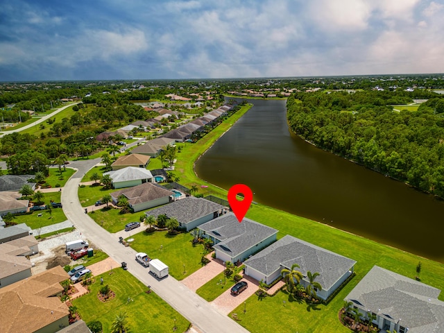 bird's eye view with a residential view and a water view