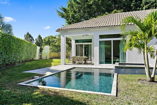 2651 Players Ct, Wellington, FL 33414 - back of house featuring stucco siding, a tiled roof, and a patio