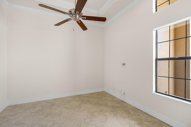 empty room featuring baseboards, a ceiling fan, and crown molding