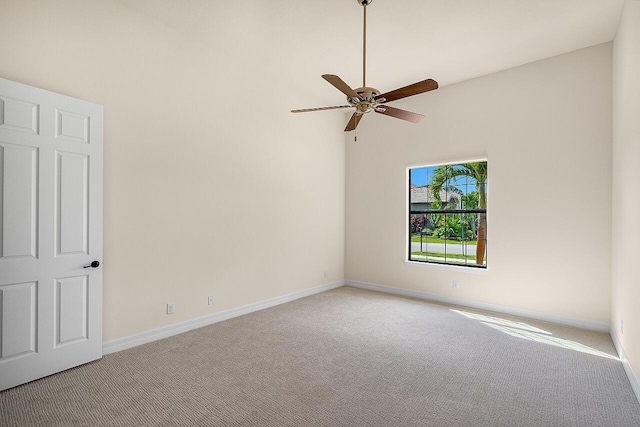 spare room featuring baseboards, a ceiling fan, and carpet floors