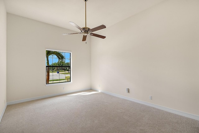 spare room with ceiling fan, baseboards, and carpet
