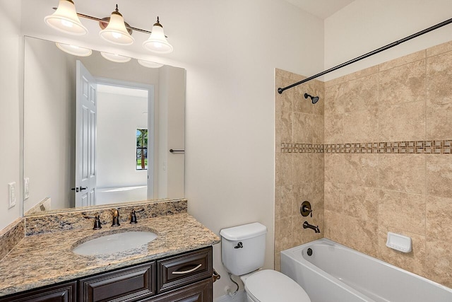 full bath featuring washtub / shower combination, vanity, and toilet
