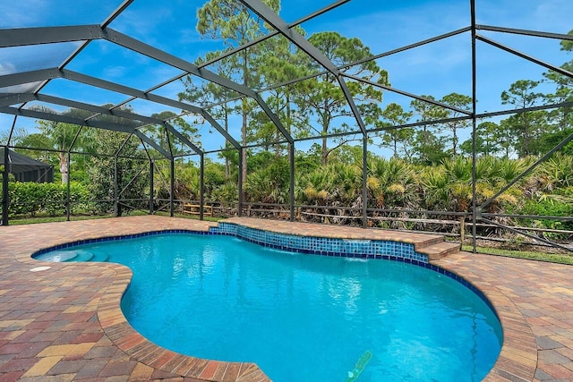 outdoor pool featuring a patio and a lanai