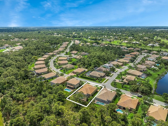 bird's eye view featuring a water view and a residential view
