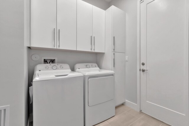 17118 Aquavera Way, Boca Raton, FL 33496 - laundry area featuring washer and dryer, light tile patterned floors, and cabinet space