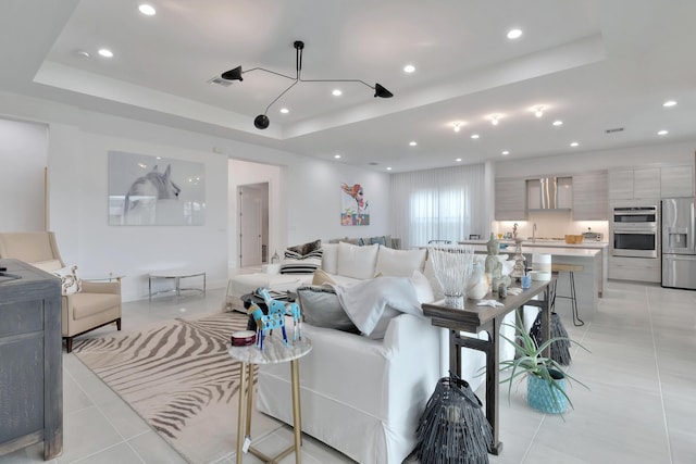 17118 Aquavera Way, Boca Raton, FL 33496 - living room with a tray ceiling, light tile patterned flooring, and recessed lighting