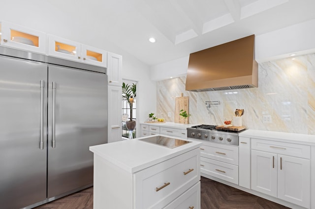 3510 Embassy Dr, West Palm Beach, FL 33401 - kitchen featuring tasteful backsplash, glass insert cabinets, wall chimney range hood, vaulted ceiling, and stainless steel appliances