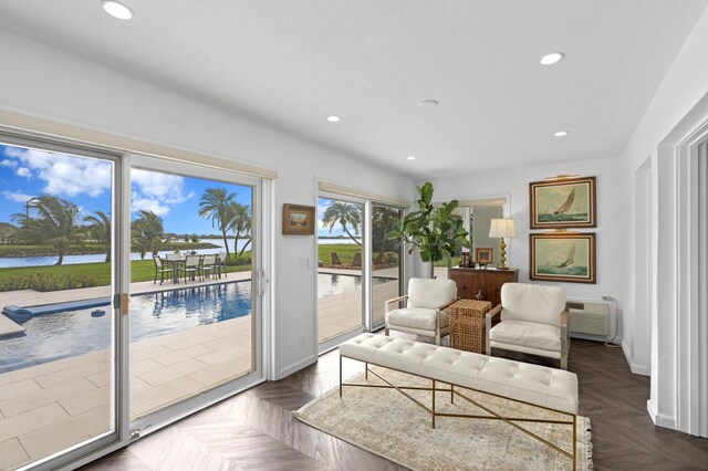 3510 Embassy Dr, West Palm Beach, FL 33401 - living room with recessed lighting, baseboards, and a wall mounted AC