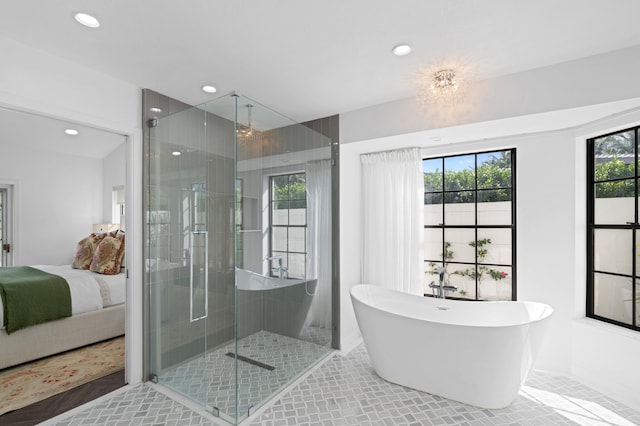 3510 Embassy Dr, West Palm Beach, FL 33401 - ensuite bathroom with a soaking tub, recessed lighting, a stall shower, tile patterned floors, and connected bathroom