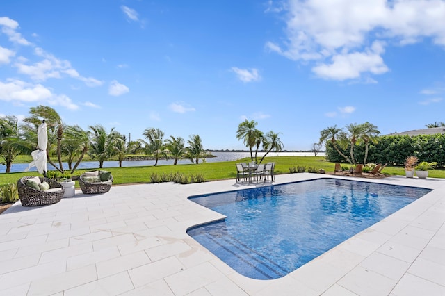3510 Embassy Dr, West Palm Beach, FL 33401 - view of swimming pool featuring a yard, a patio, and a water view