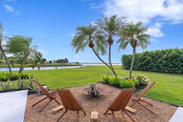 3510 Embassy Dr, West Palm Beach, FL 33401 - view of yard featuring a patio area, an outdoor fire pit, and a water view