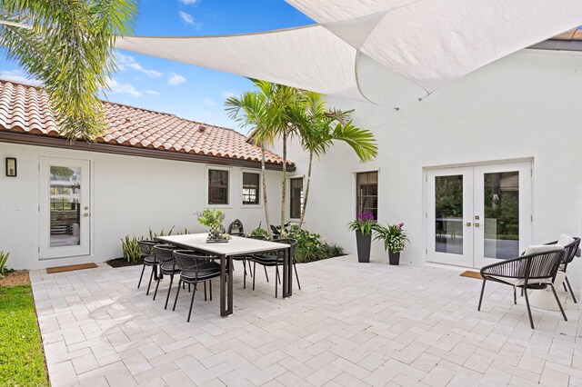 3510 Embassy Dr, West Palm Beach, FL 33401 - view of patio / terrace featuring french doors and outdoor dining area
