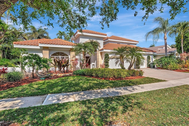 6131 NW 30th Ave, Boca Raton, FL 33496 - mediterranean / spanish-style house with an attached garage, stucco siding, concrete driveway, a front lawn, and a tiled roof