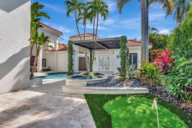 6131 NW 30th Ave, Boca Raton, FL 33496 - view of patio / terrace with french doors and a pool with connected hot tub