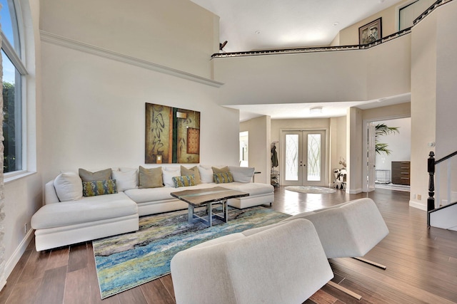 6131 NW 30th Ave, Boca Raton, FL 33496 - living area featuring french doors, baseboards, wood finished floors, and a towering ceiling