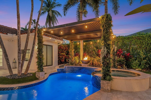 6131 NW 30th Ave, Boca Raton, FL 33496 - pool at dusk featuring an outdoor pool, an in ground hot tub, and a patio